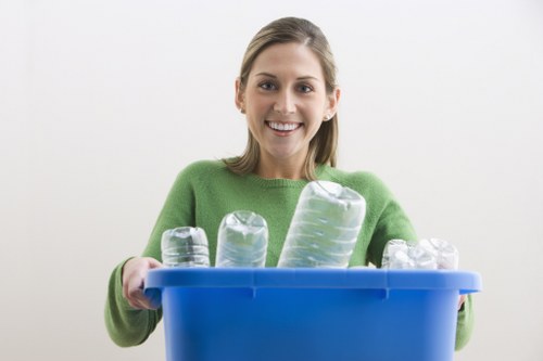 Staff sorting materials at a local transfer station
